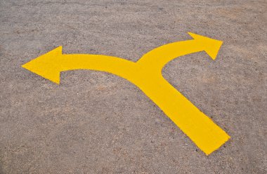 The Twin yellow arrow on the road clipart