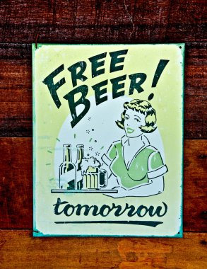The Old poster of beer on wood background clipart