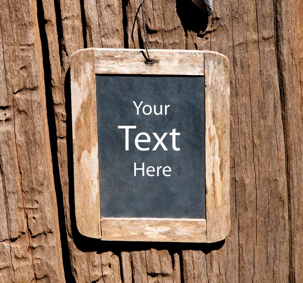 The Old wooden blackboard on wood background — Stock Photo, Image