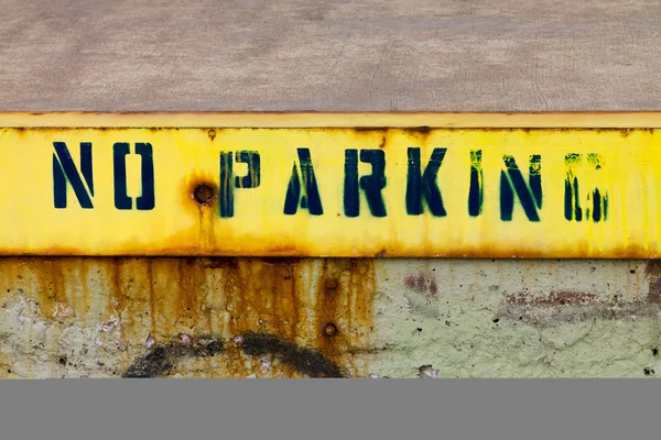 Stock image No Parking Sign Painted On Grungy Wall