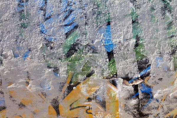 Graffiti cubierto pared viejo descolorido fondo textura — Foto de Stock