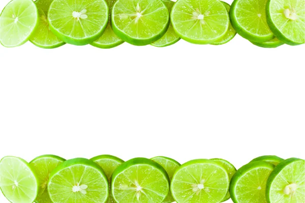 Revestimiento de limones verdes en el marco . —  Fotos de Stock