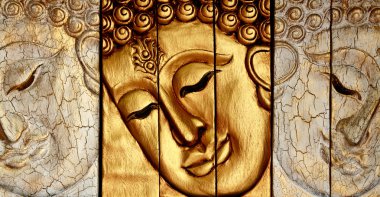 Traditional Thai style Lord Buddhas face wood carving clipart