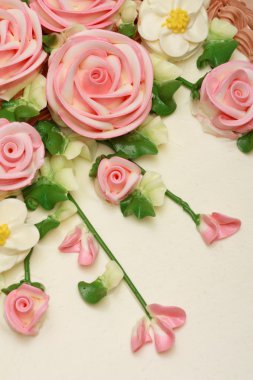 Flower cream on top of beatiful cake clipart