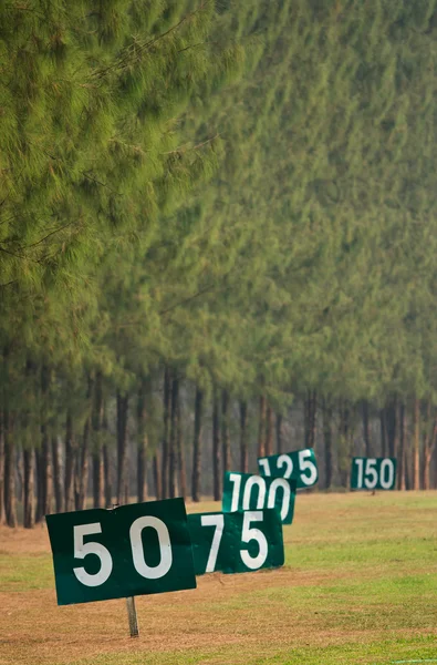 Yard signs in driving range — Stock Photo, Image