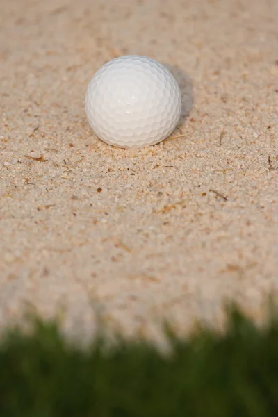 Golf ball and sand bunker — Stock Photo, Image
