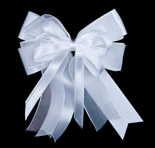 White bow on black background — Stock Photo, Image