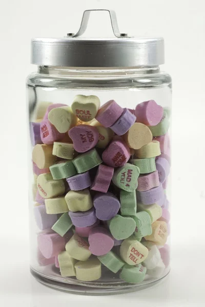 Jar with lid filled with valentine hearts — Stock Photo, Image