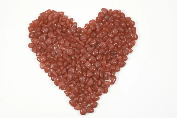 Czerwony cukierek w kształcie serca, na białym tle — Zdjęcie stockowe
