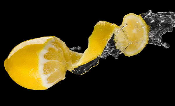 Lemon splash macro isolated over black background — Stock Photo, Image