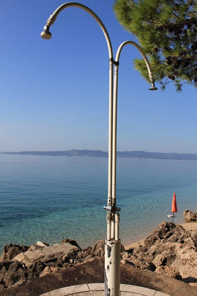 stock image Beach shower over blue sky