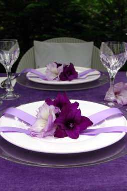 Table decoration with gladiolus. To the romantic rendezvous clipart