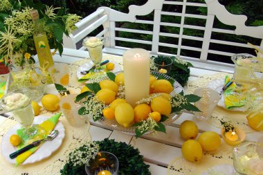 Table decoration with lemons. clipart