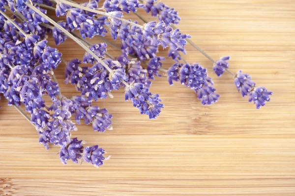 Dried lavender on a wooden desk — Stock Photo, Image