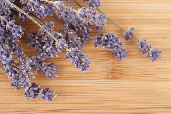 Dried lavender on a wooden desk — Stock Photo, Image