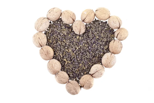 Green tea and walnuts heart — Stock Photo, Image