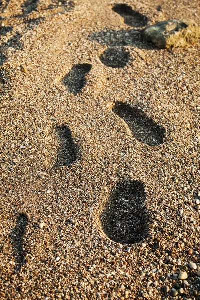 Footsign in zand — Stockfoto