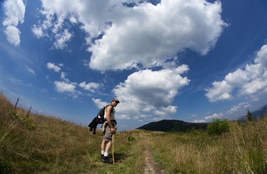 Man during mountain trip clipart