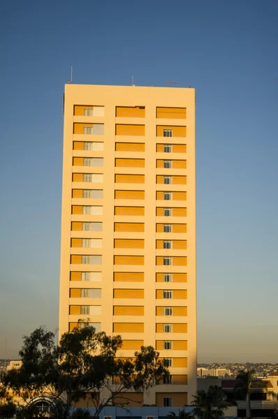 Stock image Apartment building lit by sunrise