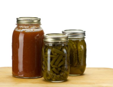 Three jars of homemade canned produce clipart