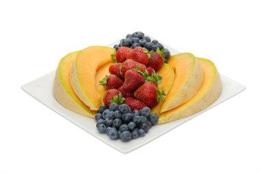 Fruit desert of berries and cantaloupe clipart