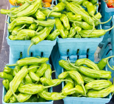 Shishito peppers displayed in baskets clipart