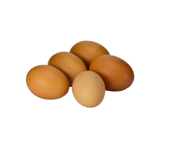Коричневые яйца на белом — стоковое фото