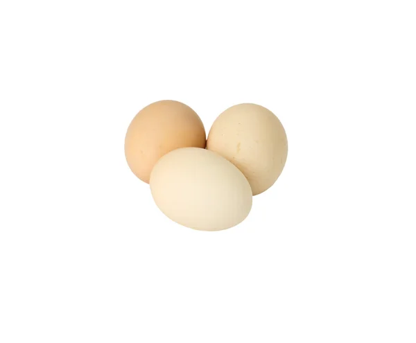 Three light brown eggs on white — Stock Photo, Image