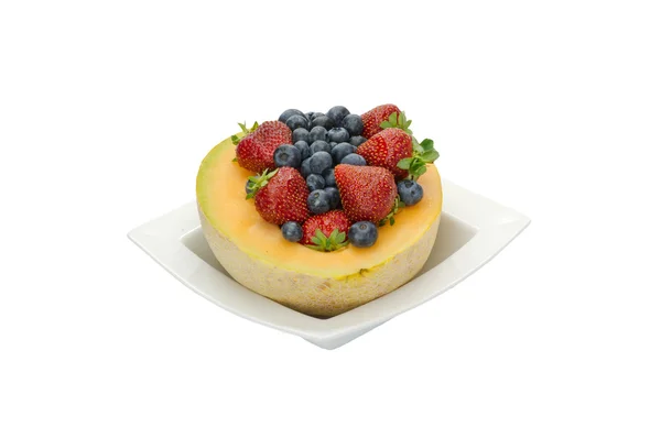 stock image Fruit desert of berries and cantaloupe in white bowl