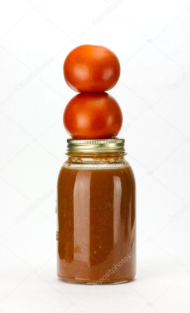 Tomatoes and tomato sauce on white