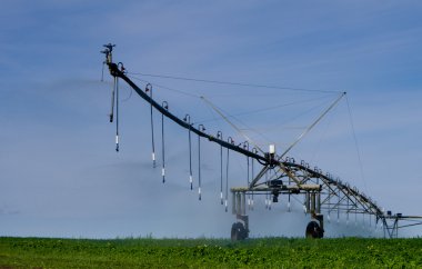 Pivot irrigation system supplies water to crops clipart