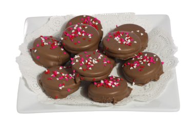 Plate of ten chocolate cookies with hearts clipart