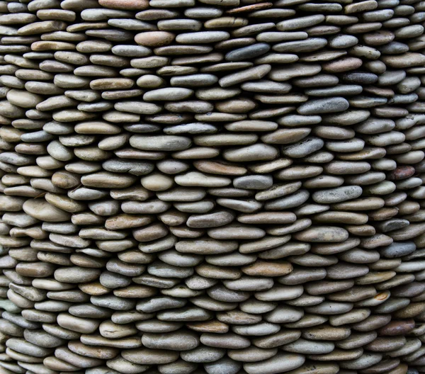 Background of pebbles arranged in order on edge — Stock Photo, Image