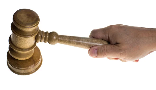 Hand gripping a gavel hitting a striker — Stock Photo, Image