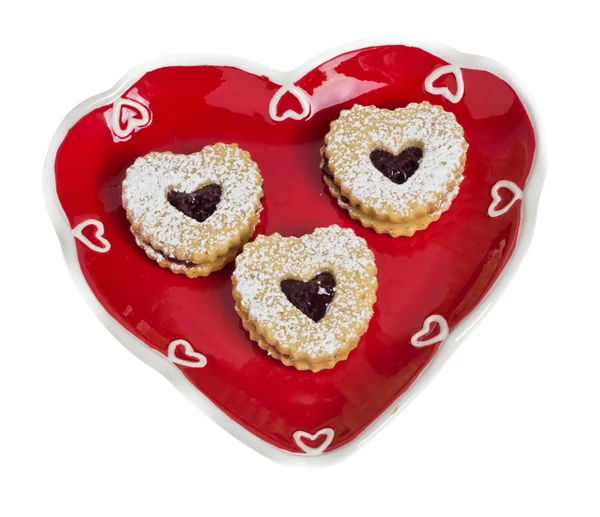 Heart shaped plate with heart shaped cookies — Stock Photo, Image