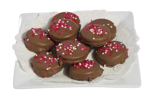 Plate of ten chocolate cookies with hearts — Stock Photo, Image