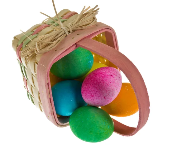Easter basket spilling dyed eggs — Stock Photo, Image