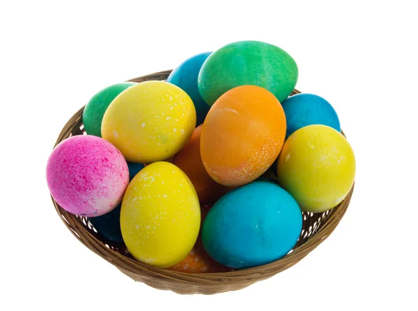 Round wicker basket of dyed eggs — Stock Photo, Image
