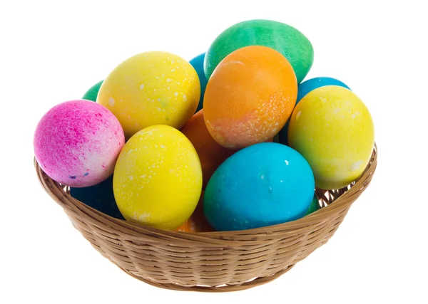 Large wicker basker of colorful Easter eggs — Stock Photo, Image