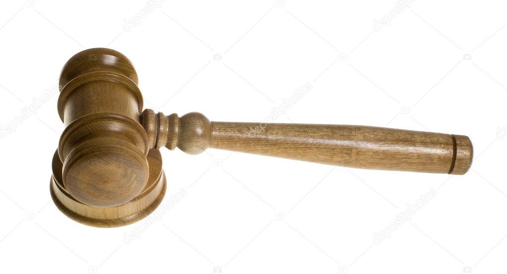Wooden gavel on strike plate isolated on white
