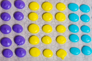 Purple yellow and blue candy dots clipart