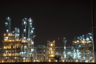 Night scene of chemical plant clipart