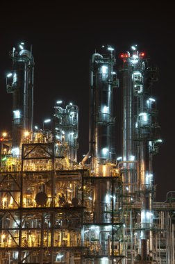 Night scene of chemical plant clipart