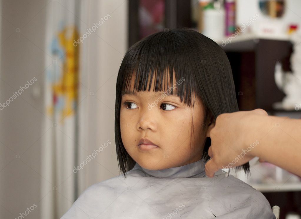 Young girl getting a haircut Stock Photo by ©supakitmod 10395012