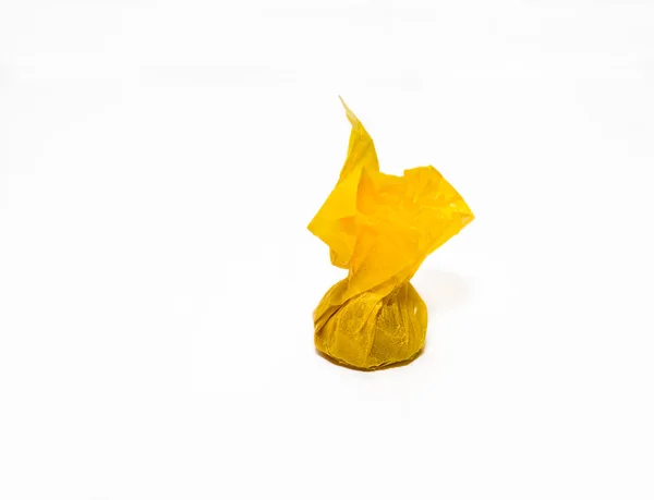 stock image Toffee in yellow wrapper