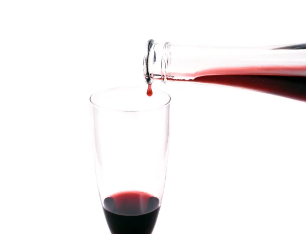 Red wine dropping from the bottle — Stock Photo, Image