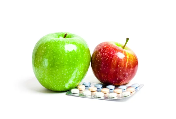 Сочные зеленые и красные яблоки и витамины Стоковое Изображение