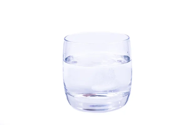 Aspirin dissolving in the glass of water — Stock Photo, Image