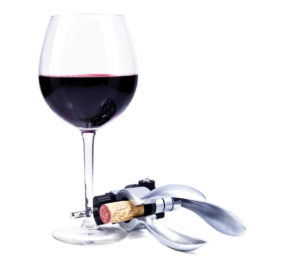 Wine glass with red wine and bottlescrew — Stock Photo, Image