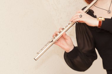 Flute in hand clipart